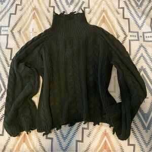 Green distressed sweater